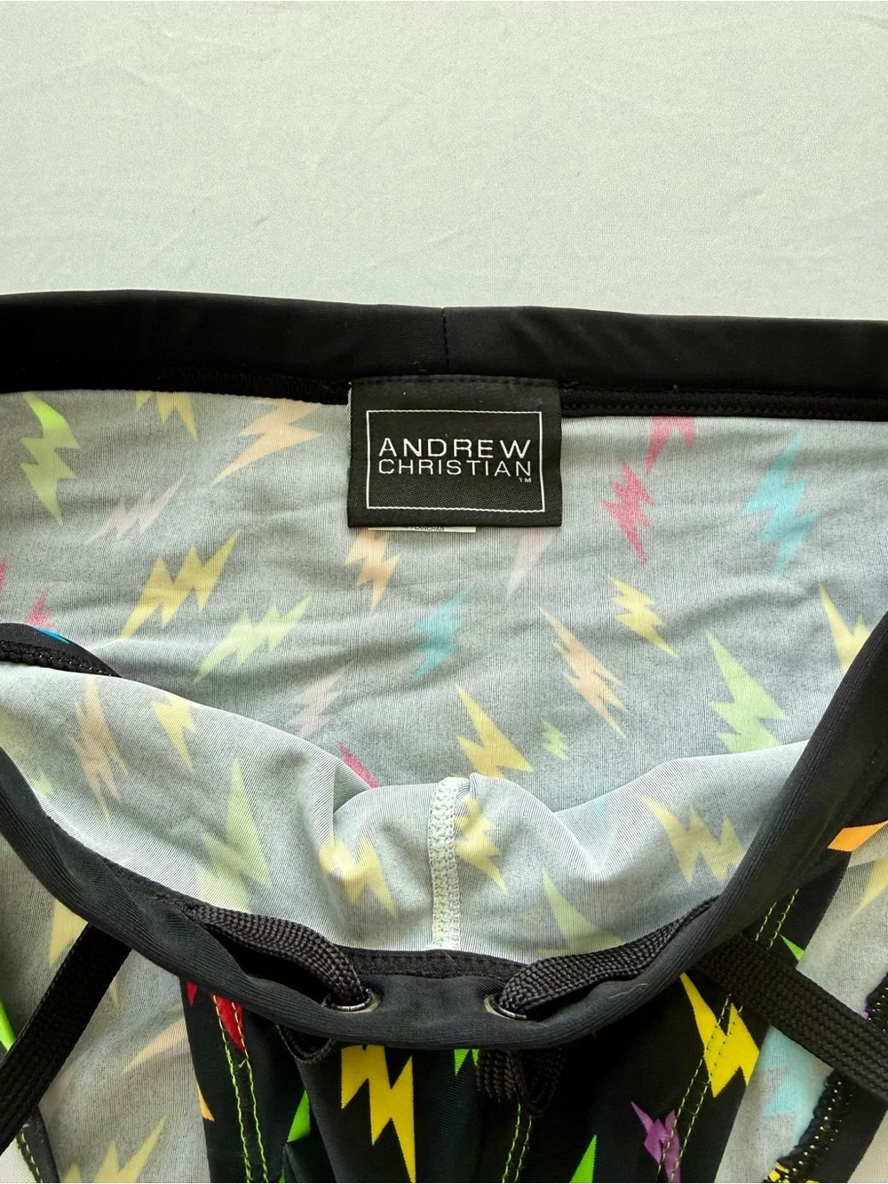 Andrew Christian Black Swim Briefs with Neon Lightning Bolts